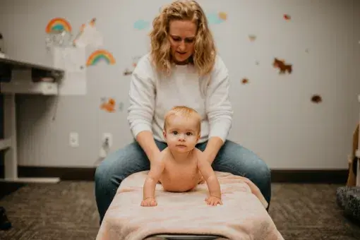 Dr. Dani, your top Pediatric Chiropractor in Sioux Falls, is adjusting a 9-month-old! 